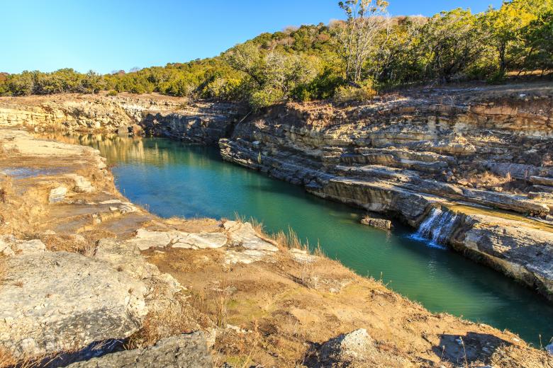 Canyon Lake Gorge formed in 2002 after many inches of rain fell and washed out the land. Just outside of New Branfels, Texas the gorge has uncovered dinosaur tracks, fossils, interesting geologically